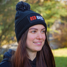 Winter knitted beanie with pom-pom REDBASS with a patch