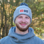 Winter knitted beanie with pom-pom REDBASS with a patch